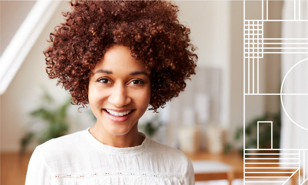 Smiling woman thinking about her dream home